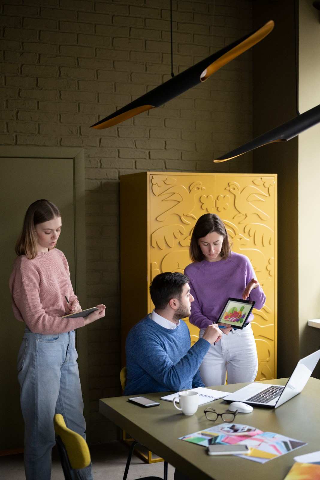 Digital marketing team collaborating on branding, website strategy, and creative campaign planning for business growth.