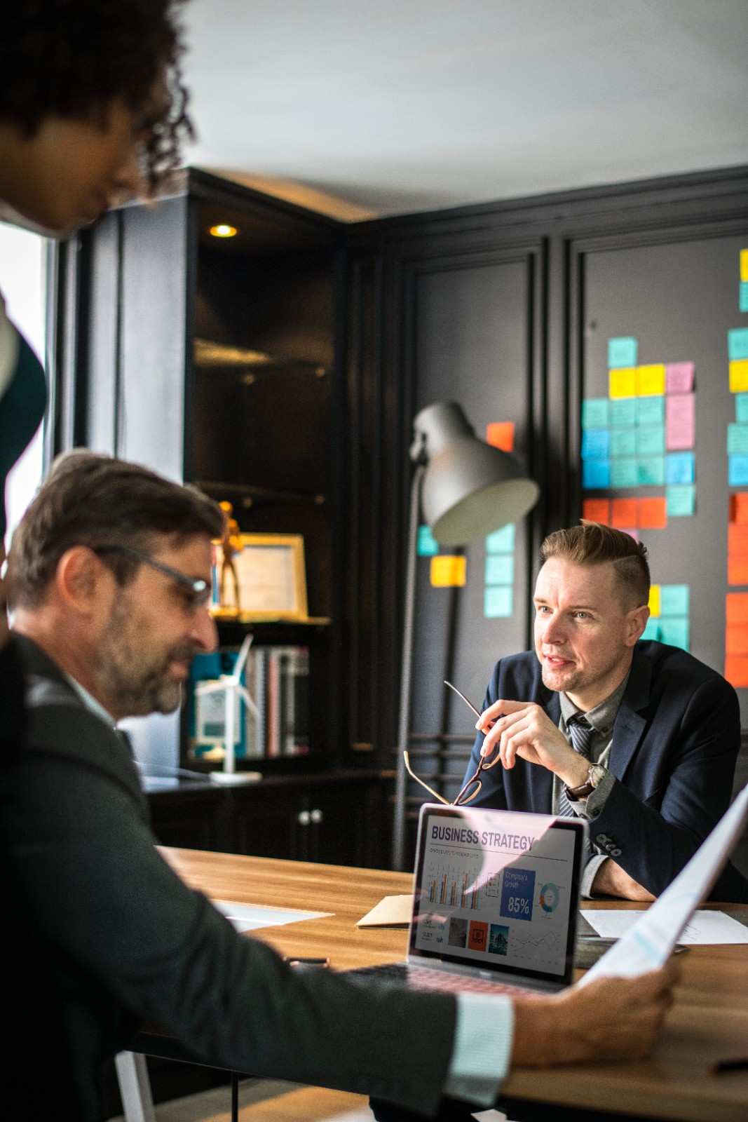 Marketing team discussing business strategy and data analytics during a meeting.