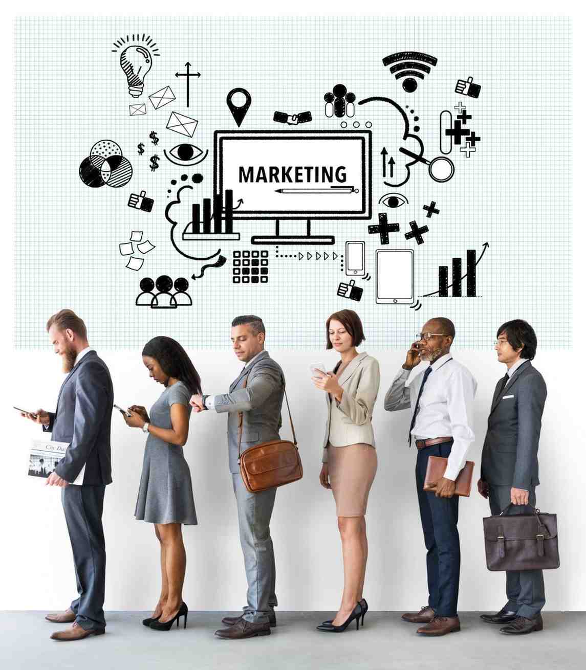 Business team before a wall of digital marketing icons.
